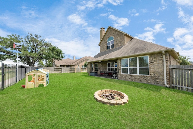 22714 Wilbur Ln, Tomball, TX 77375 - rear view of house featuring a chimney, an outdoor fire pit, a shingled roof, and brick siding