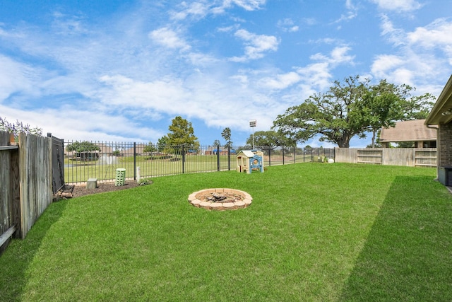 22714 Wilbur Ln, Tomball, TX 77375 - view of yard with an outdoor fire pit