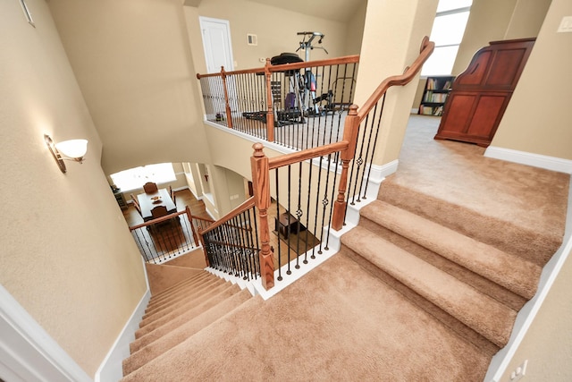 22714 Wilbur Ln, Tomball, TX 77375 - stairway featuring carpet floors and baseboards