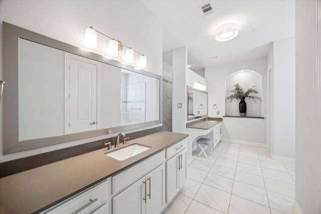 1120 Wakefield Dr, Houston, TX 77018 - full bath featuring marble finish floors, vanity, and a tile shower