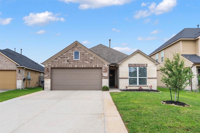 9998 Chimney Swift Ln, Conroe, TX 77385 - view of front facade with an attached garage, brick siding, concrete driveway, a front yard, and stone siding