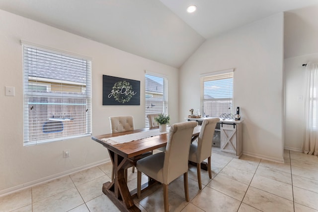 9998 Chimney Swift Ln, Conroe, TX 77385 - dining space featuring lofted ceiling, baseboards, and light tile patterned floors