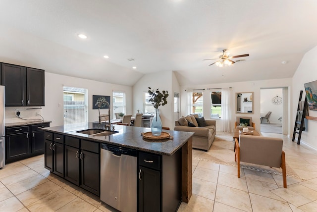 9998 Chimney Swift Ln, Conroe, TX 77385 - kitchen featuring stainless steel appliances, vaulted ceiling, a sink, ceiling fan, and light tile patterned flooring