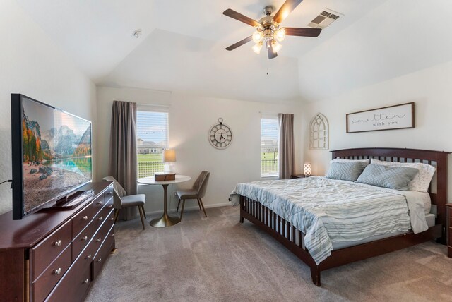 9998 Chimney Swift Ln, Conroe, TX 77385 - carpeted bedroom featuring multiple windows, lofted ceiling, ceiling fan, and baseboards