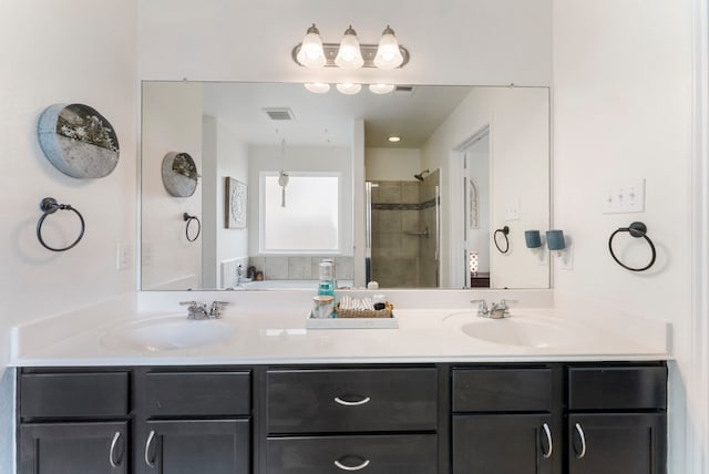 9998 Chimney Swift Ln, Conroe, TX 77385 - full bath featuring a stall shower and double vanity