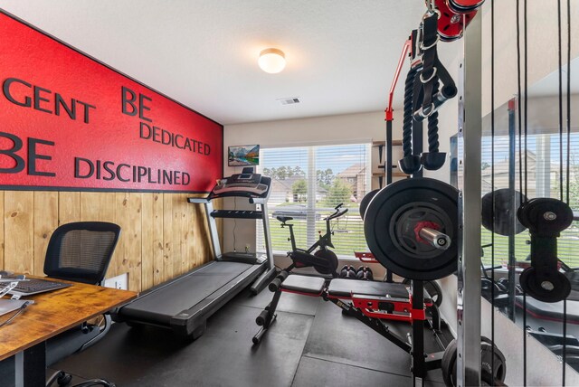 9998 Chimney Swift Ln, Conroe, TX 77385 - workout area with wooden walls