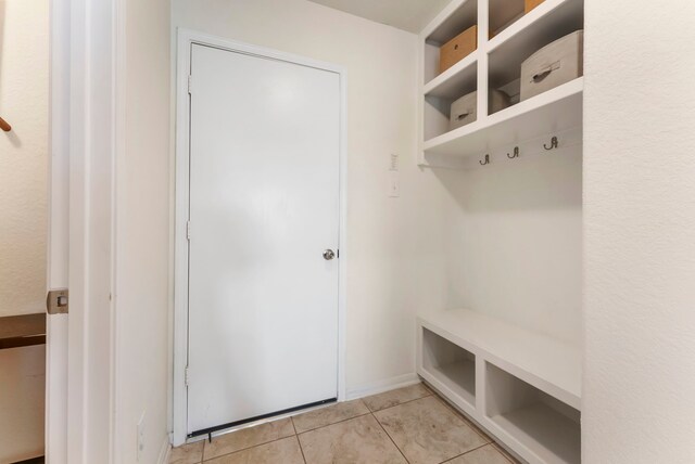 9998 Chimney Swift Ln, Conroe, TX 77385 - mudroom featuring light tile patterned floors