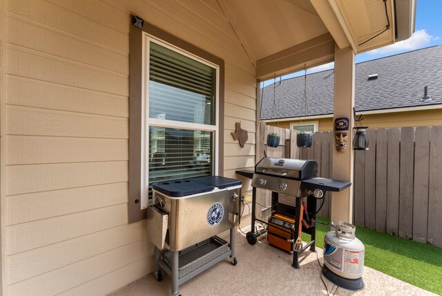 9998 Chimney Swift Ln, Conroe, TX 77385 - view of patio featuring a grill