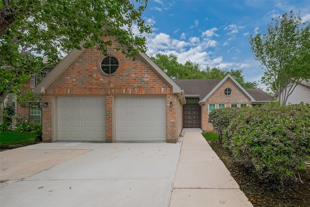4823 Sunshine Dr, Sugar Land, TX 77479 - traditional home with brick siding, driveway, and a garage
