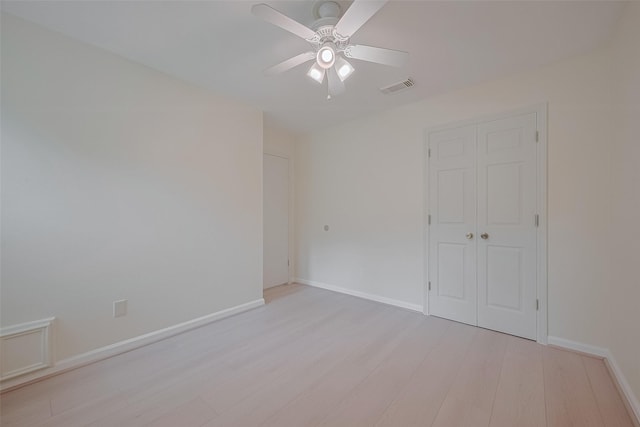 4823 Sunshine Dr, Sugar Land, TX 77479 - empty room with light wood-style flooring, a ceiling fan, and baseboards