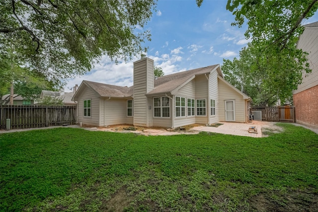 4823 Sunshine Dr, Sugar Land, TX 77479 - back of house featuring a patio and a chimney
