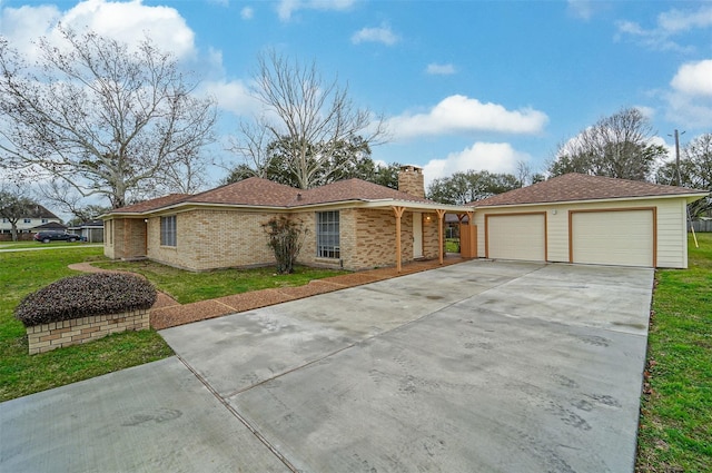 4418 W Pasadena Blvd, Deer Park, TX 77536 - ranch-style house featuring a chimney, a front lawn, concrete driveway, and brick siding