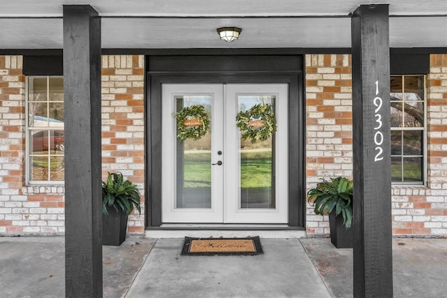 19302 Fisher Dr, Tomball, TX 77377 - doorway to property with french doors and brick siding