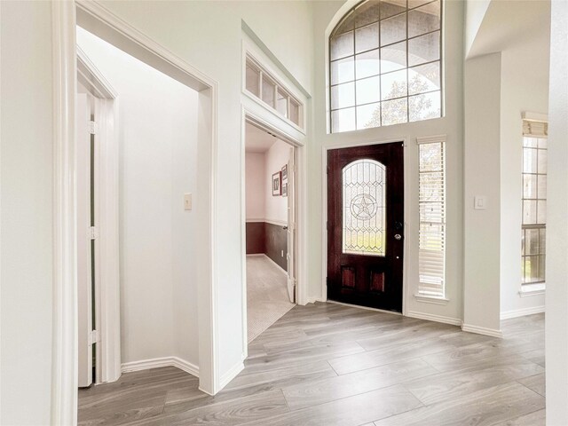6081 Trent Ct, League City, TX 77573 - foyer entrance with baseboards and light wood-style flooring
