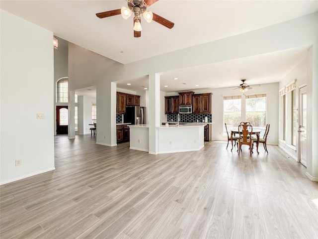 6081 Trent Ct, League City, TX 77573 - living area featuring ceiling fan, light wood-type flooring, baseboards, and recessed lighting