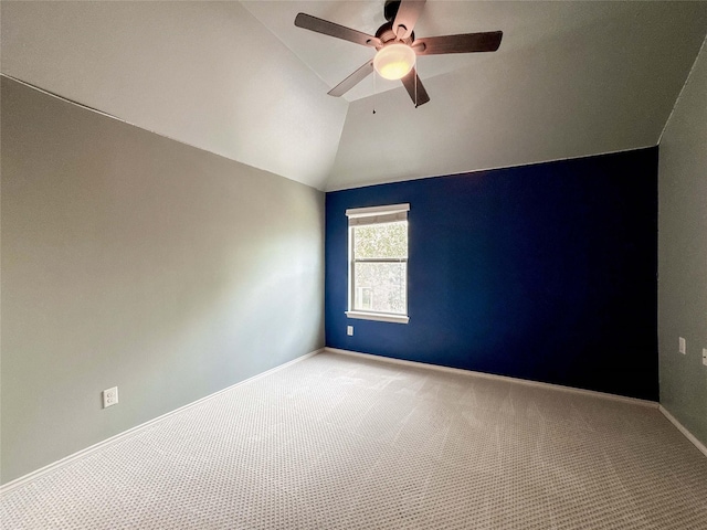 6081 Trent Ct, League City, TX 77573 - spare room featuring carpet, vaulted ceiling, a ceiling fan, and baseboards