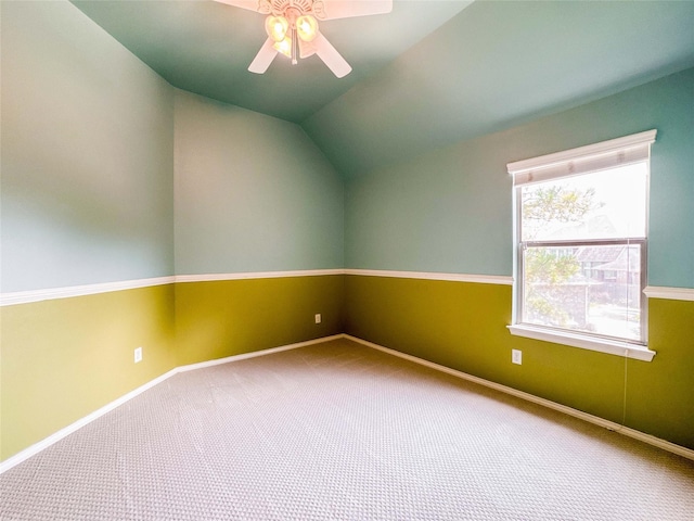 6081 Trent Ct, League City, TX 77573 - carpeted spare room featuring a ceiling fan, vaulted ceiling, and baseboards