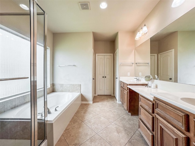 6081 Trent Ct, League City, TX 77573 - full bath with double vanity, a garden tub, a stall shower, tile patterned floors, and baseboards