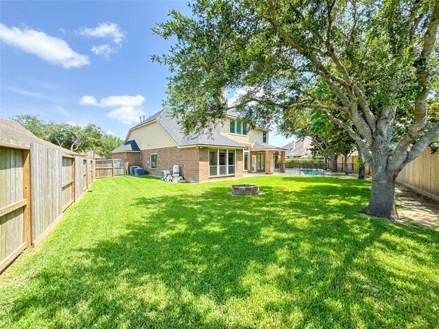6081 Trent Ct, League City, TX 77573 - view of yard featuring a fire pit and a pool