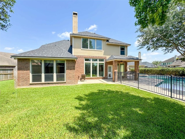 6081 Trent Ct, League City, TX 77573 - rear view of property featuring brick siding, a patio area, a chimney, and roof with shingles