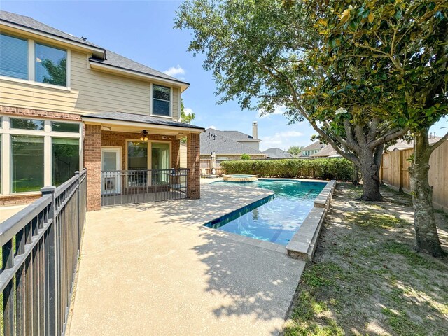 6081 Trent Ct, League City, TX 77573 - view of swimming pool with a fenced backyard, a patio area, and a pool with connected hot tub