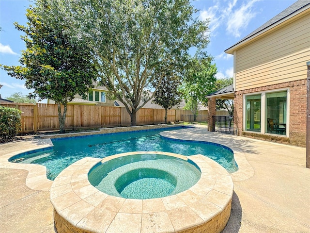 6081 Trent Ct, League City, TX 77573 - view of swimming pool with a patio, a fenced backyard, and a pool with connected hot tub