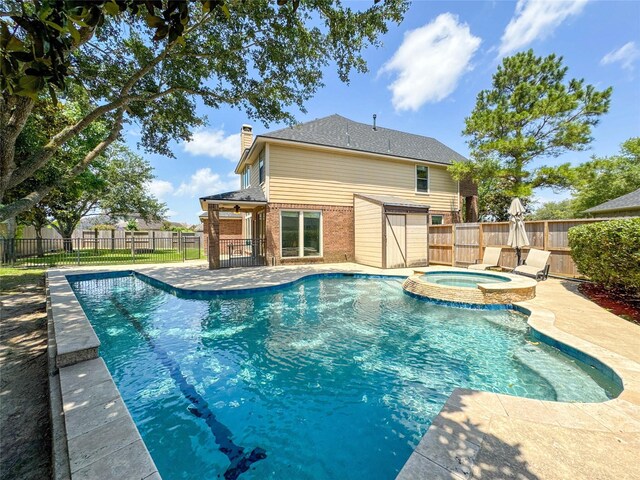 6081 Trent Ct, League City, TX 77573 - view of pool featuring a fenced backyard, a patio area, and a pool with connected hot tub
