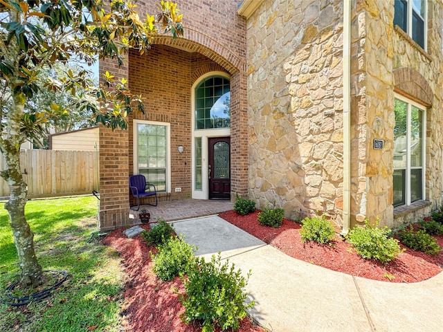6081 Trent Ct, League City, TX 77573 - view of exterior entry featuring stone siding and brick siding
