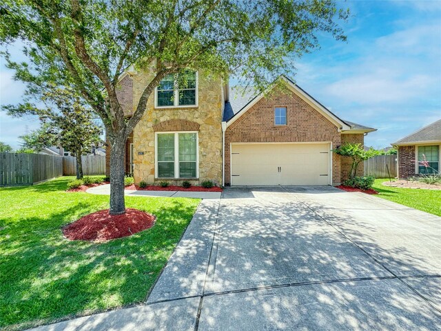 6081 Trent Ct, League City, TX 77573 - traditional home with stone siding, driveway, and a garage