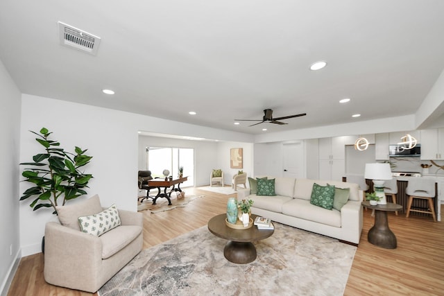 6249 Locke Ln, Houston, TX 77057 - living room featuring light wood finished floors, a ceiling fan, recessed lighting, and baseboards