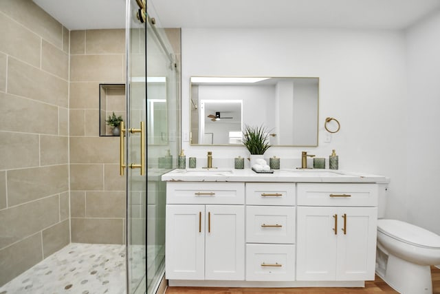 6249 Locke Ln, Houston, TX 77057 - bathroom featuring a stall shower, double vanity, and toilet