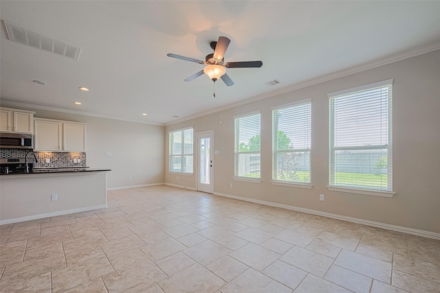 20619 Cactus Lake Ln, Richmond, TX 77407 - unfurnished living room featuring crown molding, ceiling fan, baseboards, and recessed lighting