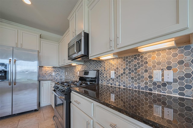 20619 Cactus Lake Ln, Richmond, TX 77407 - kitchen with appliances with stainless steel finishes, tasteful backsplash, and dark stone countertops