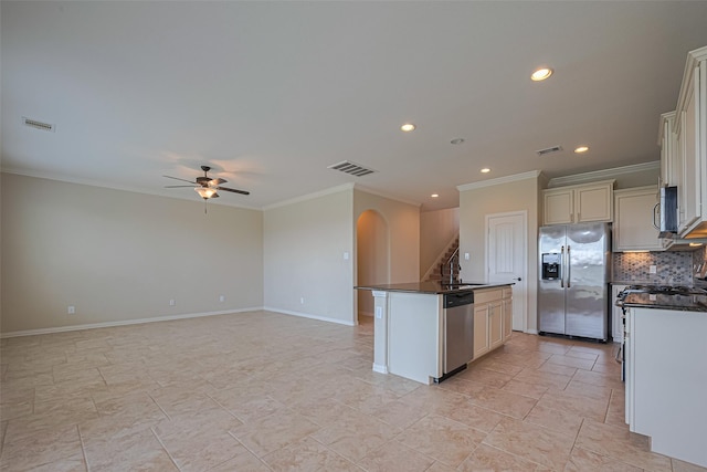 20619 Cactus Lake Ln, Richmond, TX 77407 - kitchen featuring stainless steel appliances, dark countertops, crown molding, decorative backsplash, and a ceiling fan