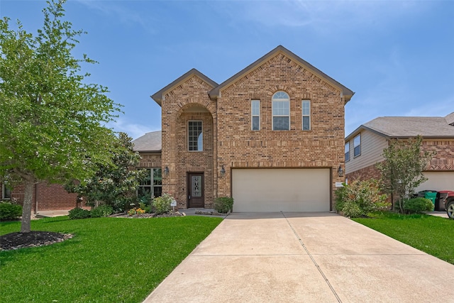 20619 Cactus Lake Ln, Richmond, TX 77407 - traditional-style house featuring brick siding, a garage, a front lawn, and driveway