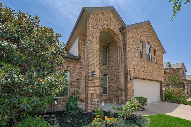 20619 Cactus Lake Ln, Richmond, TX 77407 - view of home's exterior featuring brick siding, a garage, and concrete driveway