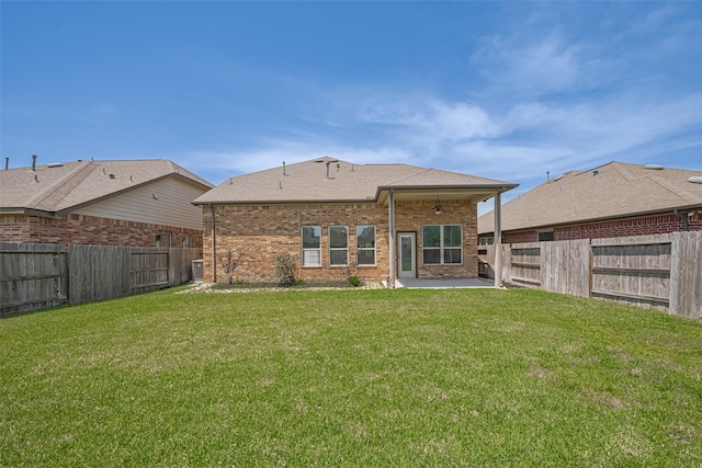 20619 Cactus Lake Ln, Richmond, TX 77407 - back of house with a patio, brick siding, and a shingled roof
