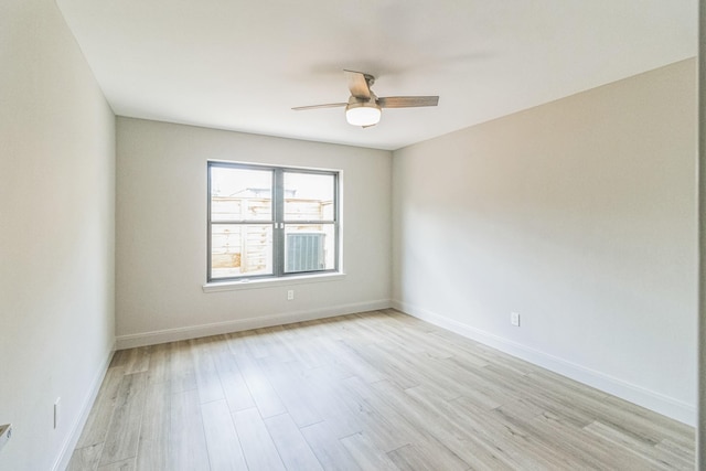 14147 Hillvale Dr, Houston, TX 77077 - empty room with light wood-type flooring, ceiling fan, and baseboards