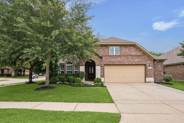 9982 Manor Spring Ln, Brookshire, TX 77423 - view of front of property with brick siding, concrete driveway, and a front yard