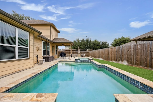 9982 Manor Spring Ln, Brookshire, TX 77423 - view of pool featuring a patio area, a fenced backyard, a pool with connected hot tub, and area for grilling
