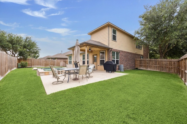 9982 Manor Spring Ln, Brookshire, TX 77423 - back of house featuring a ceiling fan, a patio area, and brick siding