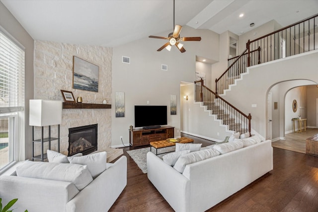9982 Manor Spring Ln, Brookshire, TX 77423 - living area with plenty of natural light, dark wood finished floors, arched walkways, a ceiling fan, and high vaulted ceiling