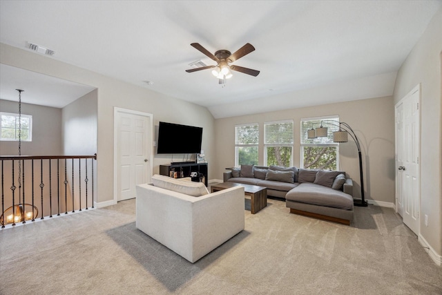 9982 Manor Spring Ln, Brookshire, TX 77423 - living room featuring light carpet, a ceiling fan, a chandelier, and baseboards