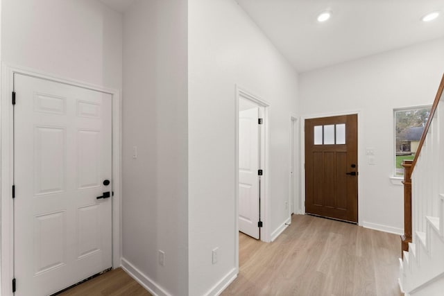 1009 Spokane River Rd, Conroe, TX 77316 - foyer with light wood-type flooring, baseboards, recessed lighting, and stairs