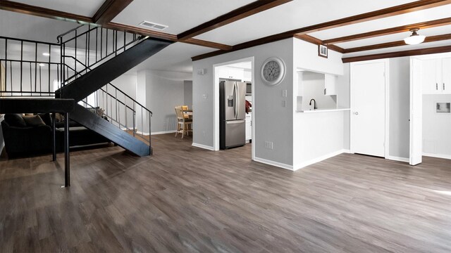 2814 Cambridge Ln, Missouri City, TX 77459 - living area with stairs, beamed ceiling, baseboards, and wood finished floors