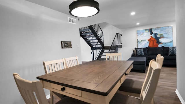 2814 Cambridge Ln, Missouri City, TX 77459 - dining space with wood finished floors, baseboards, stairs, and recessed lighting