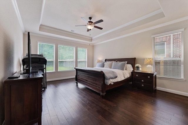 515 Arbor Point Ct, Pinehurst, TX 77362 - bedroom with a tray ceiling, ornamental molding, dark wood-style floors, baseboards, and a ceiling fan