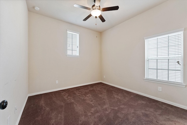 515 Arbor Point Ct, Pinehurst, TX 77362 - unfurnished room with dark colored carpet, a ceiling fan, and baseboards