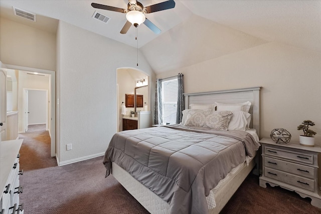 515 Arbor Point Ct, Pinehurst, TX 77362 - carpeted bedroom featuring arched walkways, lofted ceiling, ensuite bathroom, ceiling fan, and baseboards