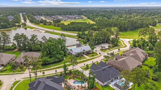 515 Arbor Point Ct, Pinehurst, TX 77362 - aerial view of residential area with a forest, a nearby body of water, and a pool